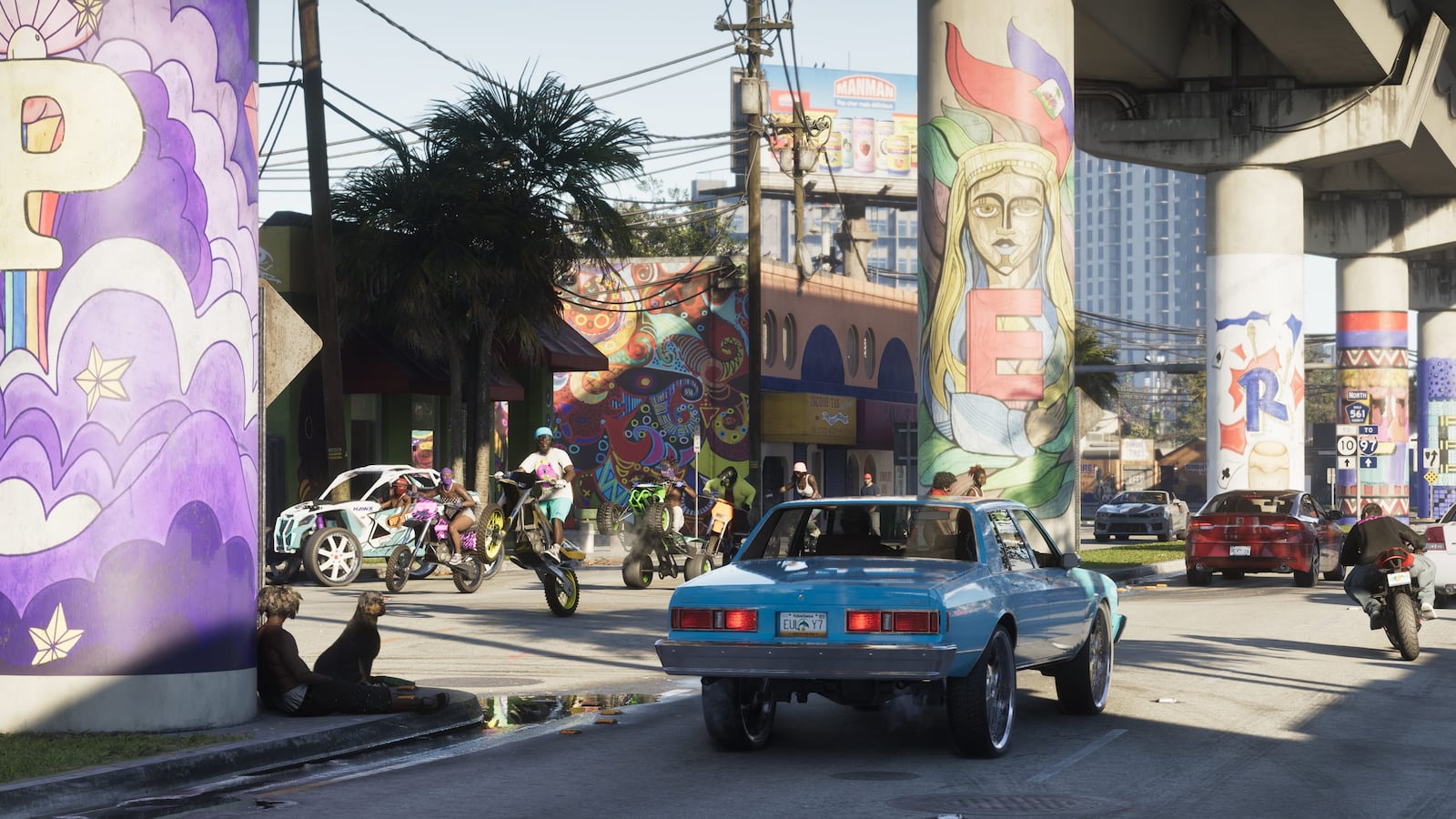 Official GTA VI screenshot of a colorful Vice City street beneath painted overpasses